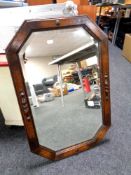 An Edwardian oak octagonal framed mirror
