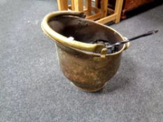 A 19th century swing handled coal bucket containing coal,