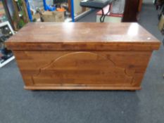 A contemporary pine blanket chest
