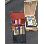 Two artist's boxes containing pencils,