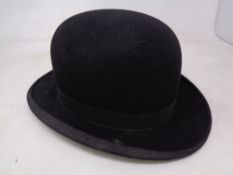 A bowler hat by Dunn & Co Ltd,