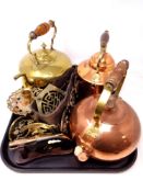 A tray of three copper and brass kettles, brass pistol ornament on stand,