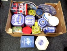 A box containing assorted tins and Ringtons ceramics.