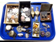 A tray containing miscellanea, including costume jewellery, wristwatches, cuff links,