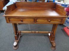 A Victorian mahogany washstand fitted two drawers.