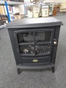 A Dimplex electric fire in the form of a stove.