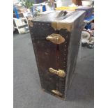 An early 20th century metal bound shipping trunk