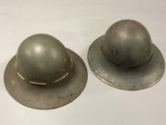 Two Second World War tin helmets