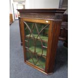 A 19th century mahogany glazed door corner cabinet