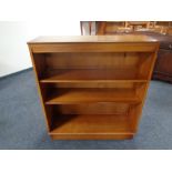 A set of yew wood open bookshelves