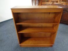 A set of yew wood open bookshelves