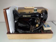 A 20th century Singer sewing machine in case (electric)