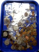 A tray containing a quantity of pre-decimal British coinage, crowns, foreign coins, etc.