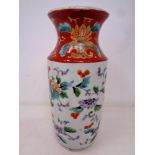 A Chinese glazed porcelain vase decorated with birds and foliage. Height 19.