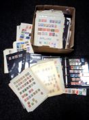 A box of hundreds of 20th century world stamps on paper