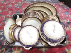 A box containing 19th century Wedgwood and Company blue white and gilt dinner ware,