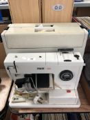 A Pfaff 122 electric sewing machine with foot pedal, cased.