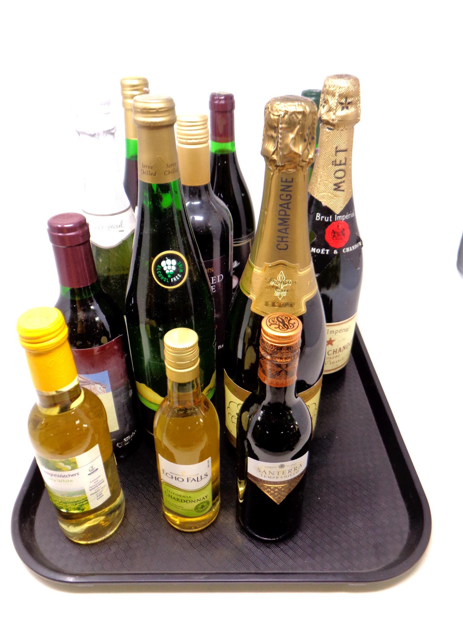 A tray of various alcohol, California Chardonnay, Moet and Chandon champagne,