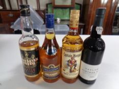 Five various bottles of alcohol including Captain Morgan, Prince Consort brandy, Taylor's port,