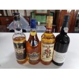 Five various bottles of alcohol including Captain Morgan, Prince Consort brandy, Taylor's port,