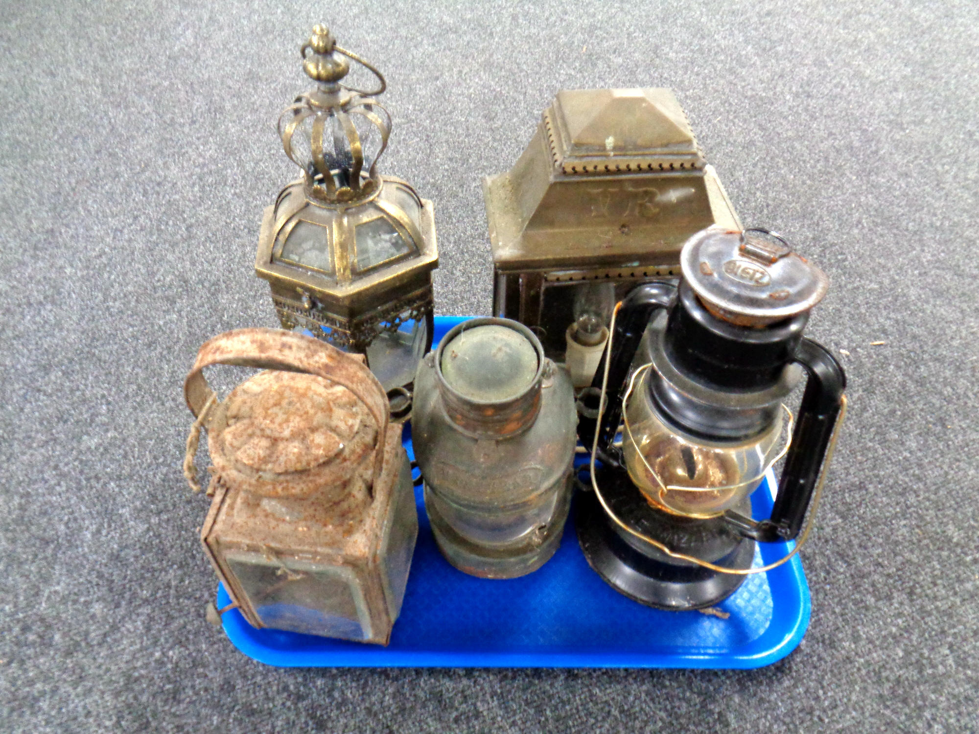 A tray of five assorted maritime, railway, oil lamps, brass wall light initialled VR,