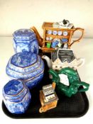 A tray of Ringtons collector's teapots and lidded blue and white caddies