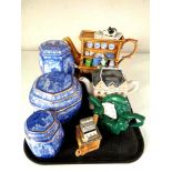 A tray of Ringtons collector's teapots and lidded blue and white caddies