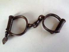 A pair of 19th century steel hand cuffs