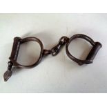 A pair of 19th century steel hand cuffs