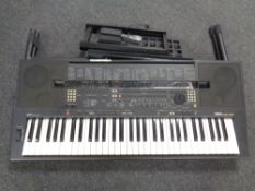 Yamaha PSR-5Q16 Keyboard on stand with foot pedal.