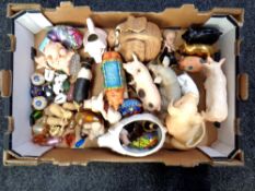 A box containing ceramic glass and resin pig ornaments to include Leonardo, Country Artists,