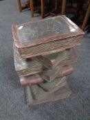 A plant stand in the form of a stack of books