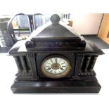 A Victorian simulated marble mantel clock