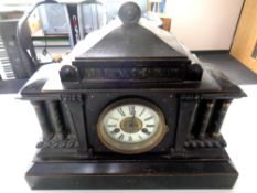 A Victorian simulated marble mantel clock