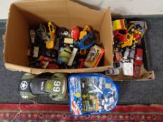 Two boxes of die cast and plastic vehicles,