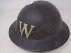 A WWII ARP Warden's helmet