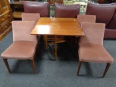 A twentieth century antique G Plan gateleg table together with a set of four chairs upholstered in