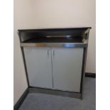 A granite topped stainless steel framed storage cabinet and contents