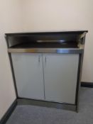 A granite topped stainless steel framed storage cabinet and contents