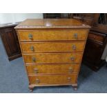 A walnut five drawer chest together with barley twist occasional table