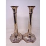 A pair of loaded silver candlesticks, London marks, height 31 cm.