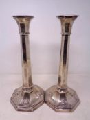 A pair of loaded silver candlesticks, London marks, height 31 cm.