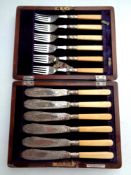 A canteen of silver plated fish cutlery together with a further oak canteen of stainless steel