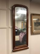 A continental mahogany framed mirror 110 cm x 44 cm