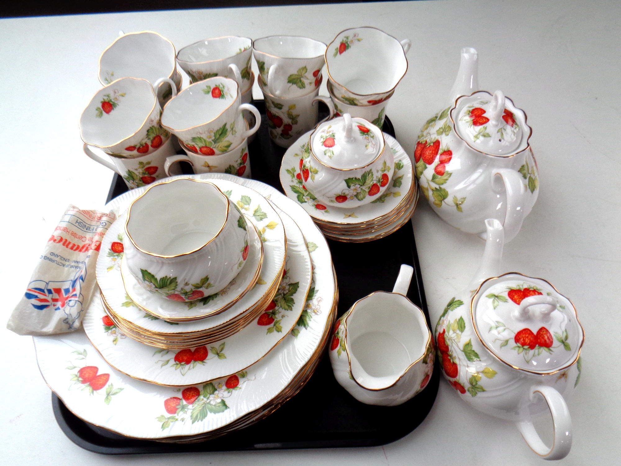 Approximately 39 pieces of Crownford Virginia Strawberry pattern tea and dinner china made