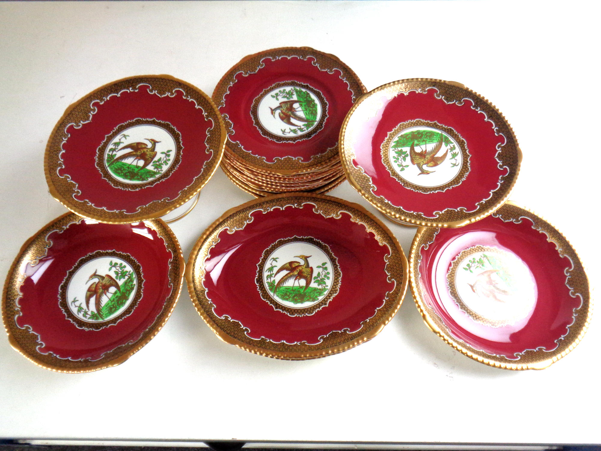 A quantity of Solian ware red and gilt dessert plates and pair of comports together with a Maling
