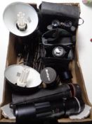 A box of angle poise lamps, Panasonic Lumix camera, Filmpost 12 x 50 field glasses,
