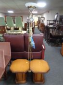 A brass floor lamp together with a pair of octagonal occasional tables.