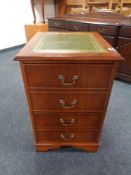 A yew wood two drawer filing cabinet with green tooled leather inset panel