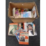 A box of sheet music and music books